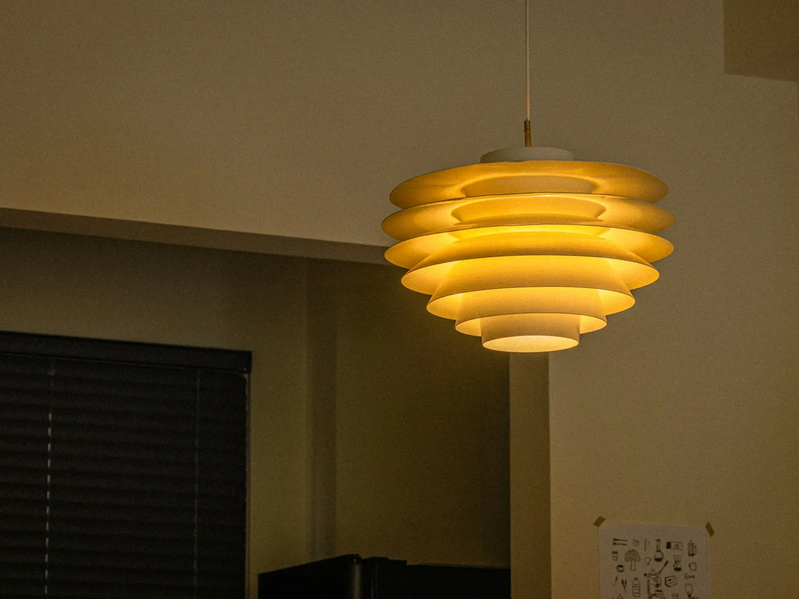 A sculptural pendant shown as a representative architectural-lighting direction