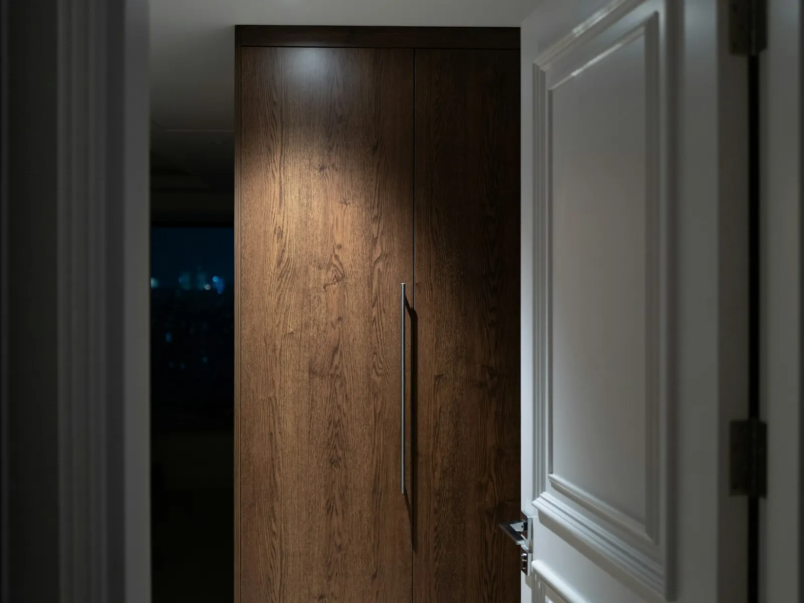 A full-height timber interior door shown as a representative opening direction