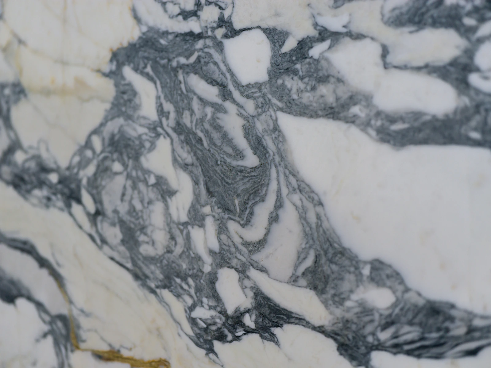 Natural veined stone shown as a representative slab and surface direction