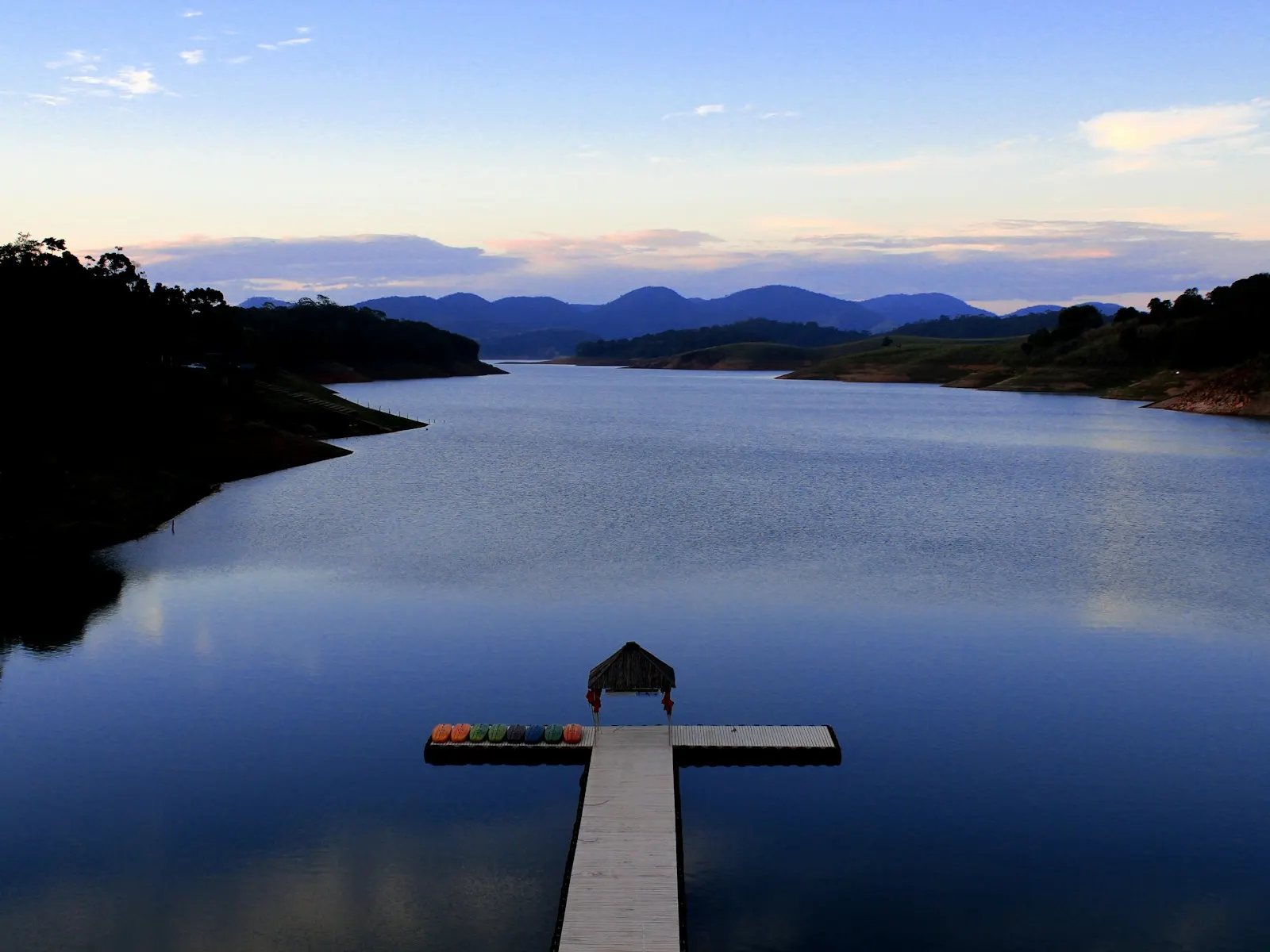 A dock extending into a calm lake shown as representative waterfront context