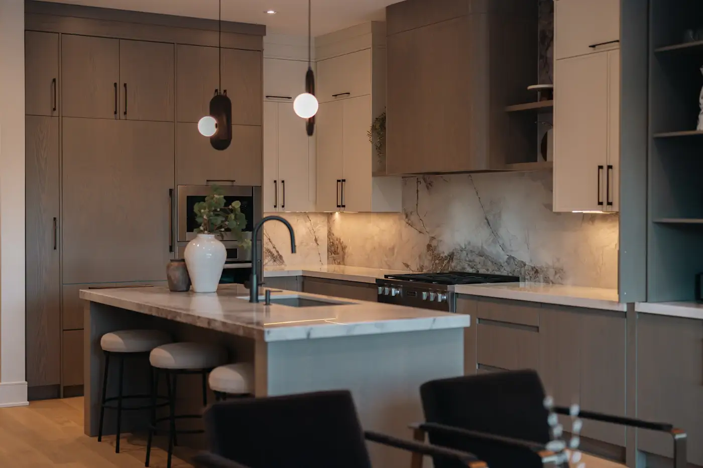 Warm contemporary kitchen and stone surfaces shown as a representative interior